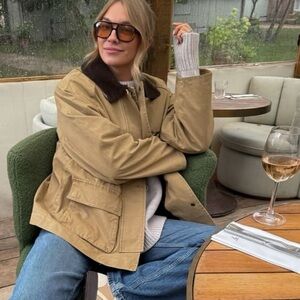 Adorable barn jacket.  
Leather collar